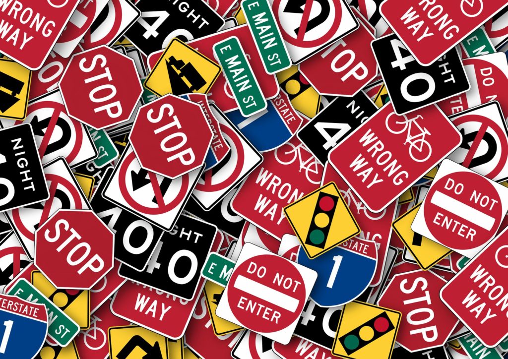all kinds of road warning signs jumbled together.