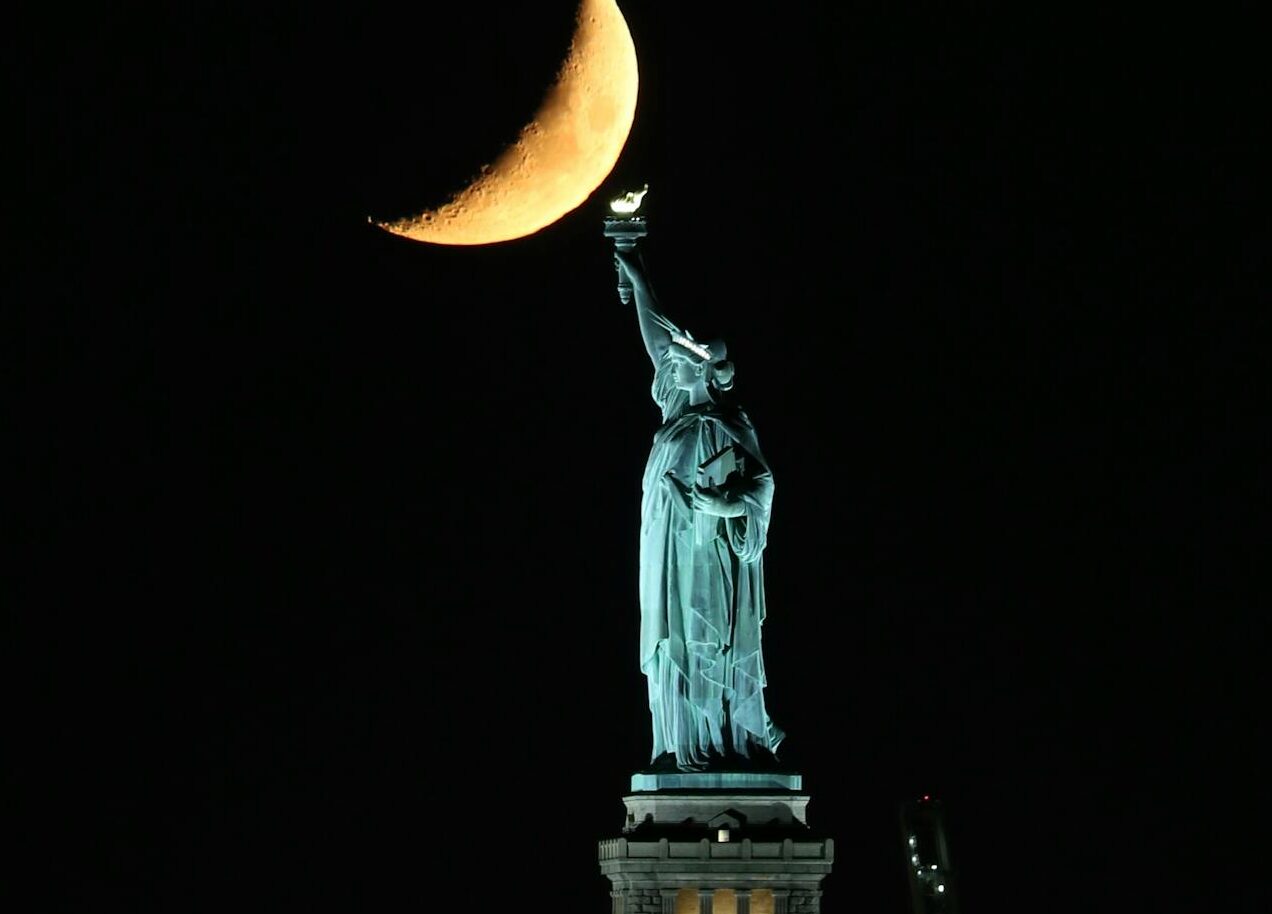 Moon with lady liberty at night