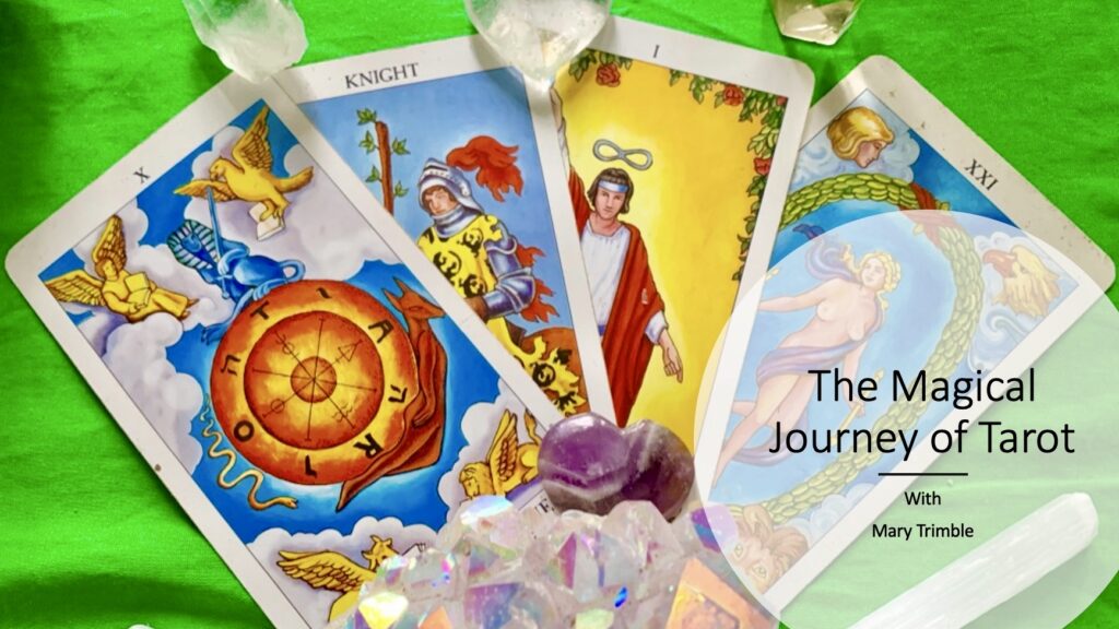 Tarot cards with crystals on a green background with type by Mary Trimble